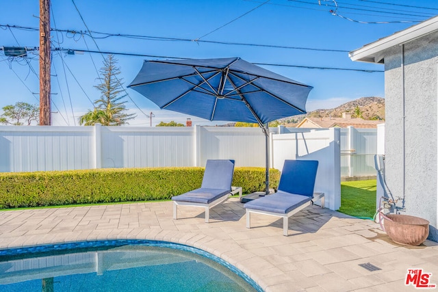 exterior space featuring a fenced in pool