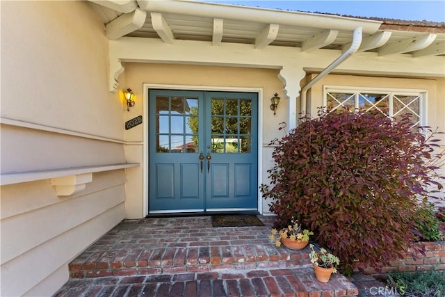 doorway to property featuring french doors