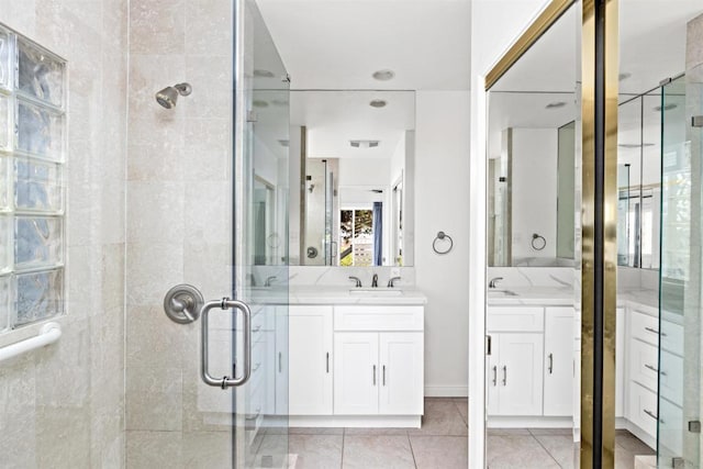 bathroom featuring vanity, an enclosed shower, and tile patterned floors