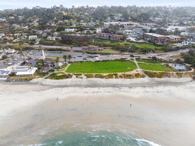 drone / aerial view with a water view and a view of the beach