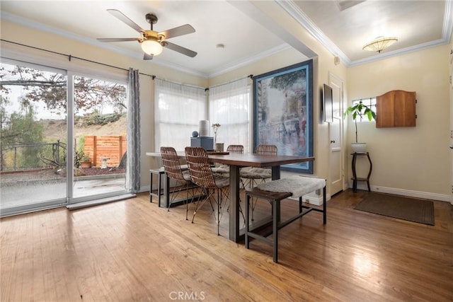 dining room featuring ornamental molding, ceiling fan, and light hardwood / wood-style flooring