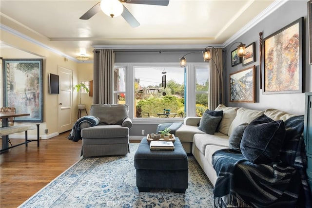 living room with hardwood / wood-style flooring and ornamental molding