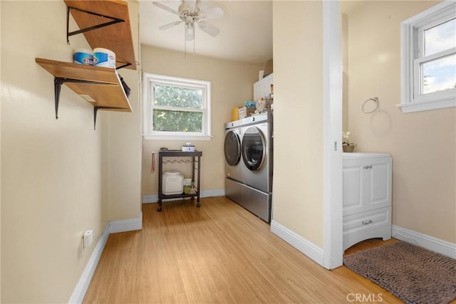 clothes washing area with cabinets, ceiling fan, light wood-type flooring, and independent washer and dryer