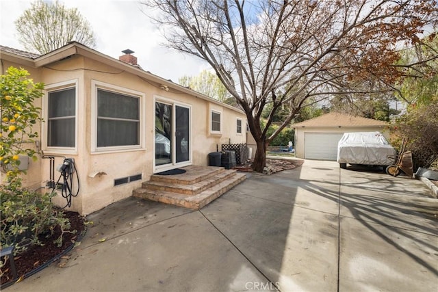 exterior space with an outbuilding, a garage, and central air condition unit