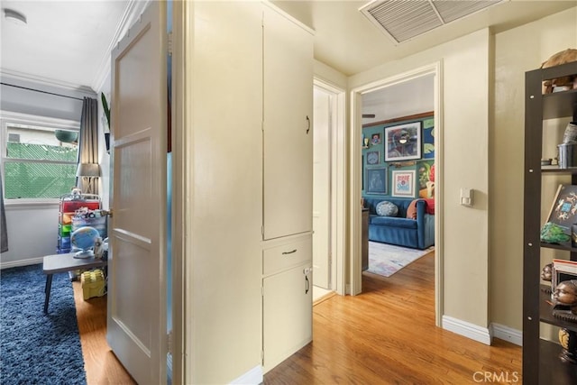 hall with light hardwood / wood-style flooring