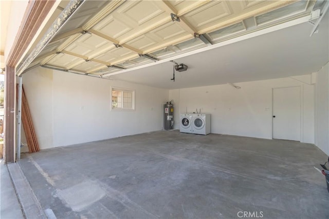 56766 Golden Bee Dr, Yucca Valley, CA 92284 - garage with separate washer and dryer, electric water heater, and a garage door opener
