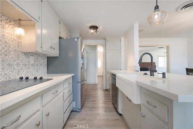 56766 Golden Bee Dr, Yucca Valley, CA 92284 - kitchen with light countertops, decorative backsplash, and a sink