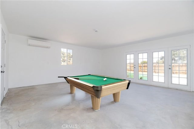 56766 Golden Bee Dr, Yucca Valley, CA 92284 - playroom featuring a wall unit AC, concrete flooring, and billiards