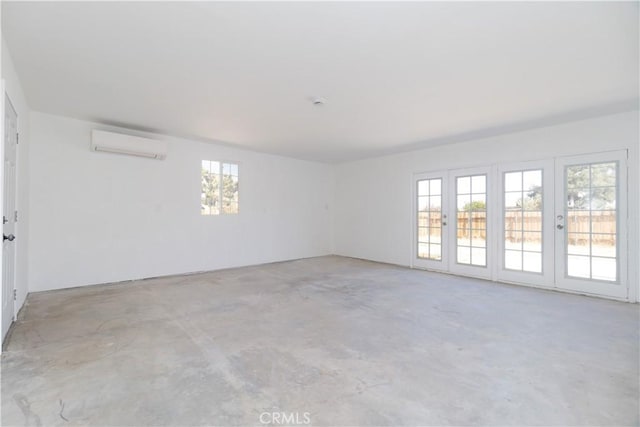 56766 Golden Bee Dr, Yucca Valley, CA 92284 - unfurnished room featuring a wall mounted air conditioner and concrete floors