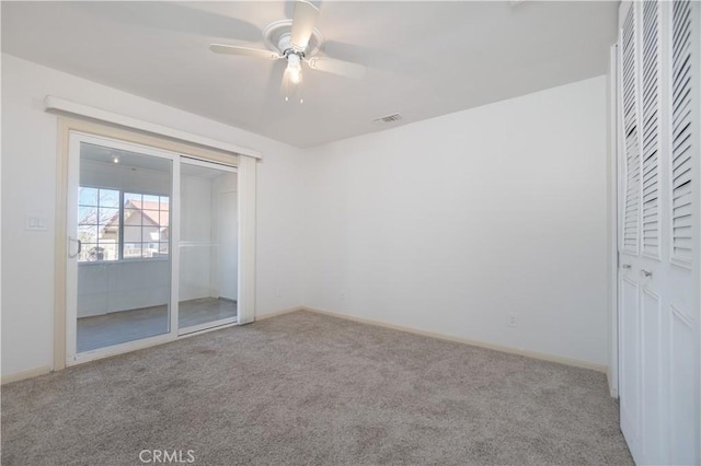 56766 Golden Bee Dr, Yucca Valley, CA 92284 - unfurnished bedroom featuring carpet, baseboards, and ceiling fan