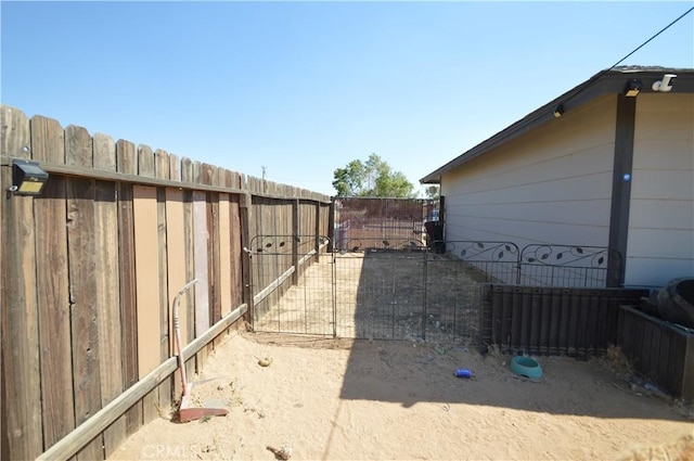 view of yard with a gate and fence