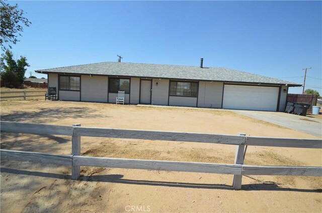 single story home with a garage