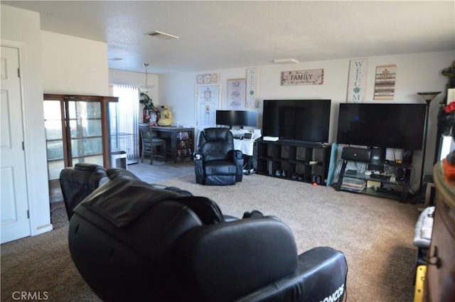 carpeted living area featuring visible vents