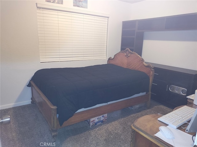 bedroom featuring dark carpet