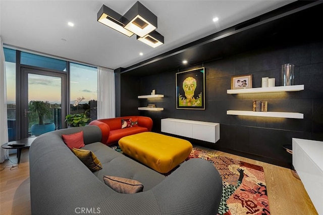 cinema with wood finished floors and recessed lighting