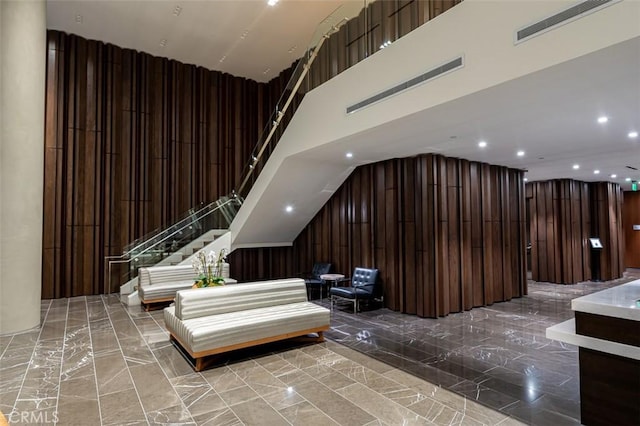 community lobby featuring visible vents and stairway