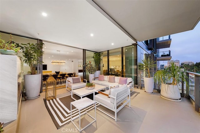 interior space with a wall of windows, recessed lighting, and concrete flooring