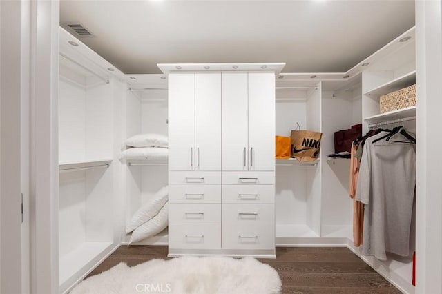 spacious closet with wood finished floors and visible vents