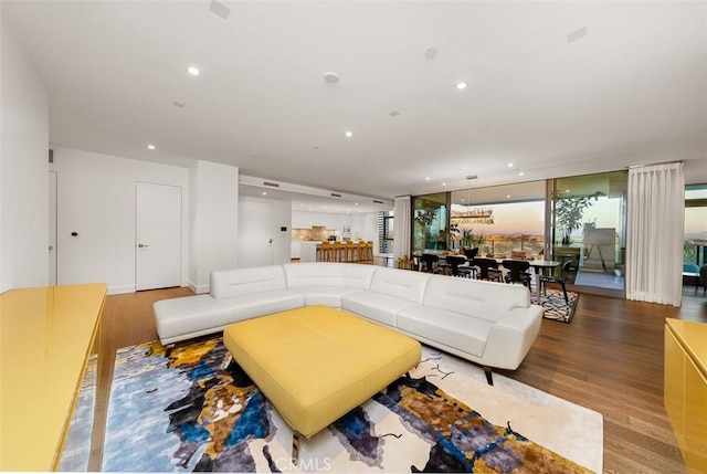 living area featuring recessed lighting and wood finished floors