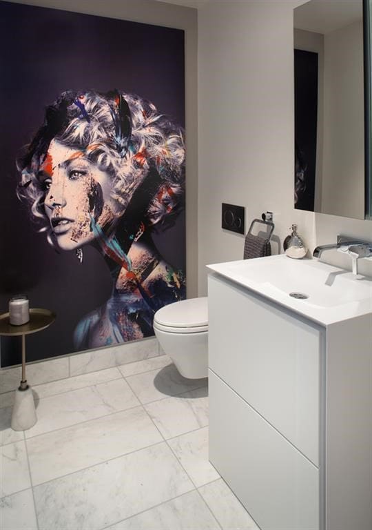 bathroom with toilet, marble finish floor, and vanity