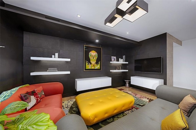 home theater room featuring recessed lighting, tile walls, and wood finished floors