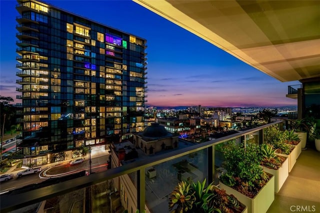 view of balcony at dusk