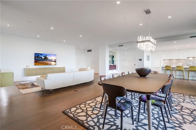 2855 5th Ave Unit 703, San Diego, CA 92103 - dining room with wood finished floors, a chandelier, and recessed lighting