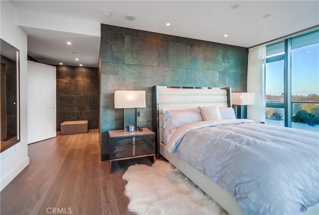 2855 5th Ave Unit 703, San Diego, CA 92103 - bedroom with tile walls, wood finished floors, and recessed lighting