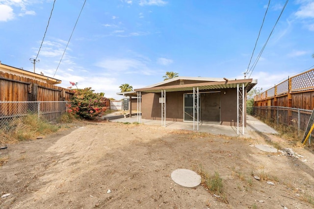 back of property with a patio area