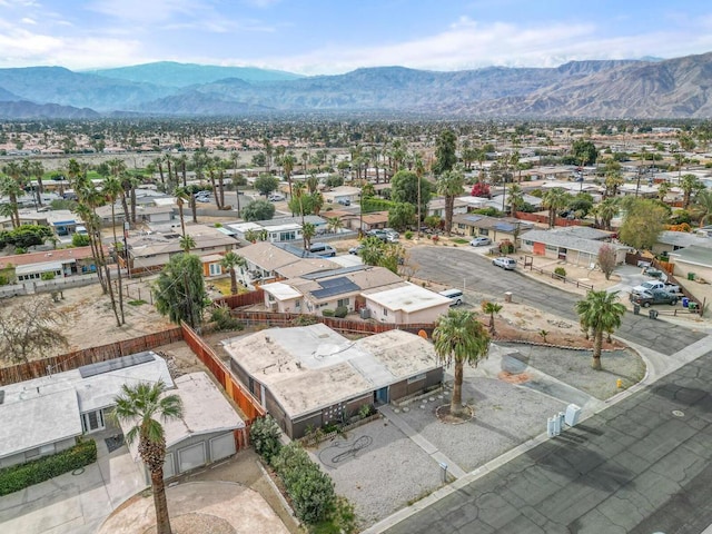 birds eye view of property featuring a mountain view