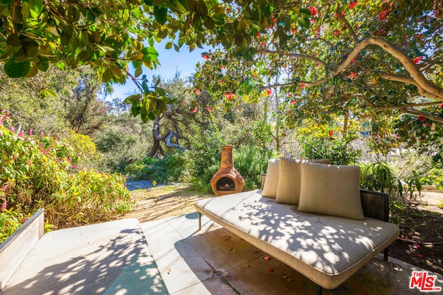 view of patio featuring exterior fireplace