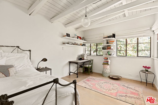 bedroom with beamed ceiling, wood ceiling, and light hardwood / wood-style flooring