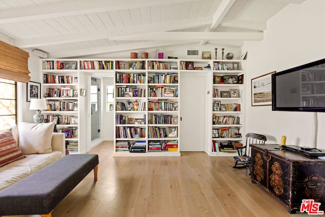 living area with vaulted ceiling with beams, wood ceiling, and light hardwood / wood-style floors