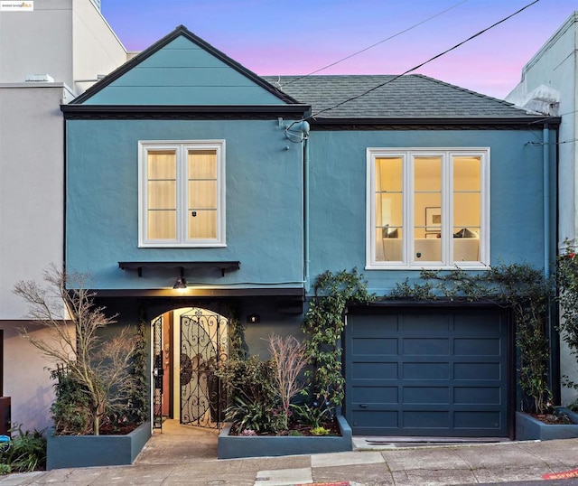 view of front of property featuring a garage