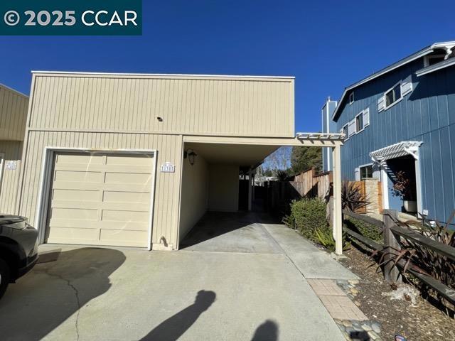 garage with a carport