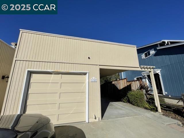 garage featuring a carport