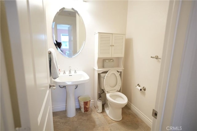 bathroom with tile patterned floors and toilet