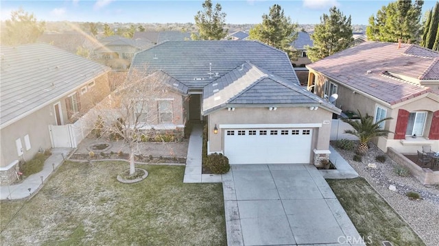 view of front of house with a garage and a front yard