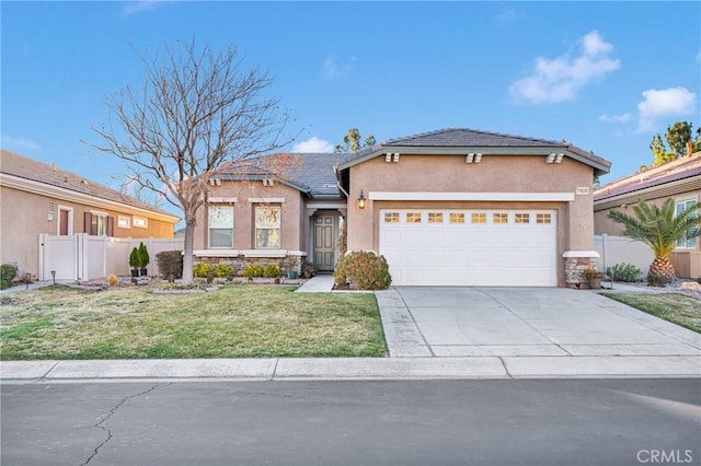 view of front facade with a garage and a front lawn