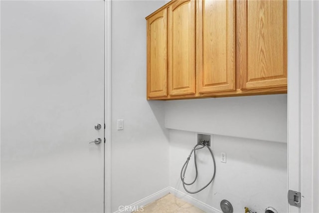 washroom featuring cabinets, hookup for a gas dryer, and hookup for a washing machine