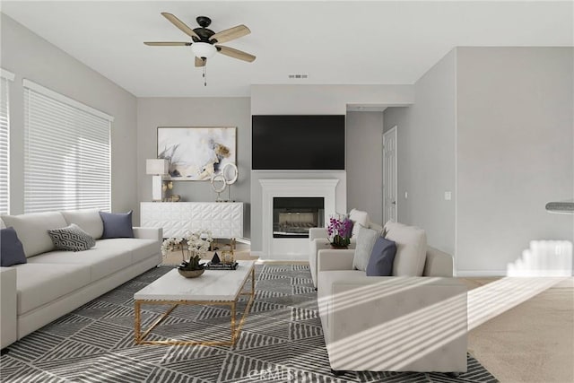 living room with ceiling fan and carpet floors