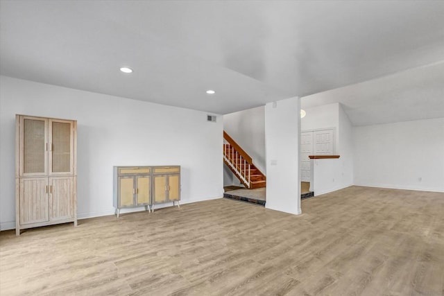 unfurnished living room featuring light wood-type flooring