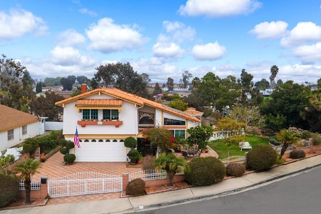 front of property with a garage