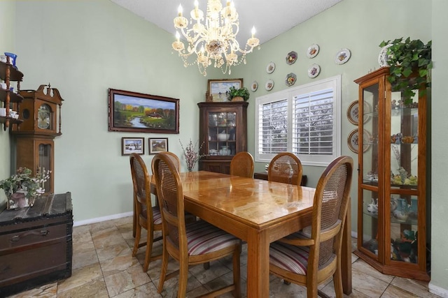 dining space featuring an inviting chandelier