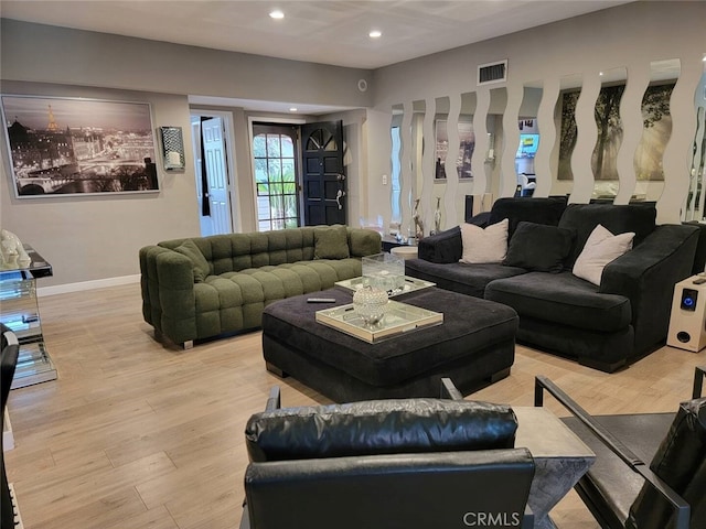 living room with light hardwood / wood-style flooring