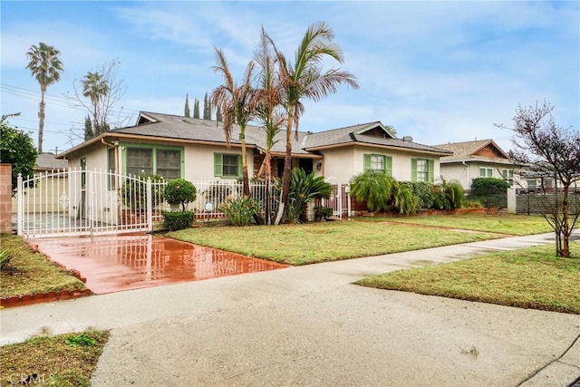 ranch-style house featuring a front lawn