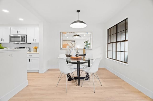 dining room featuring light hardwood / wood-style flooring