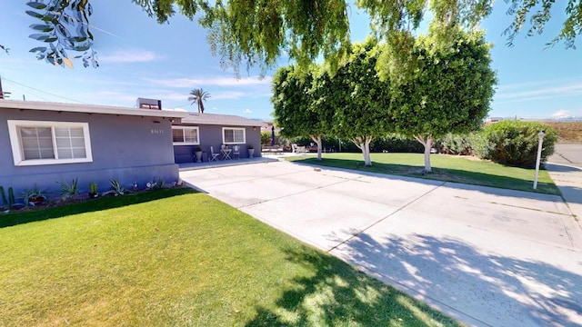 exterior space with a yard and a patio area