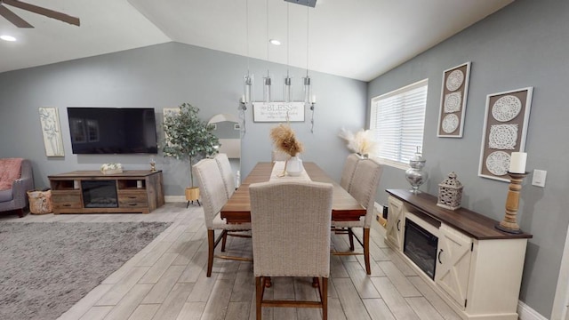 dining area featuring lofted ceiling and ceiling fan