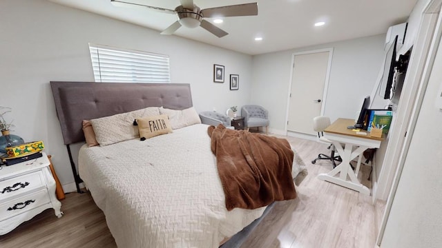 bedroom featuring ceiling fan and light hardwood / wood-style floors